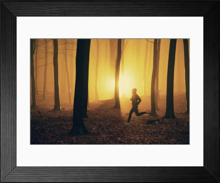 Framed Print : Jogger at sunrise in misty forest Framed Print : Jogger at sunrise in misty forest