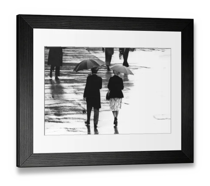 Framed Print : Wet Ascot. 20th June 1980: A couple stroll under brollies in rain at first day at Ascot