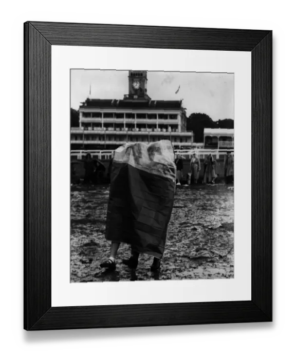 Framed Print : Rain Gear. Two spectators at Ascot wearing a tent-like bag to protect them from the rain Framed Print : Rain Gear. Two spectators at Ascot wearing a tent-like bag to protect them from the rain