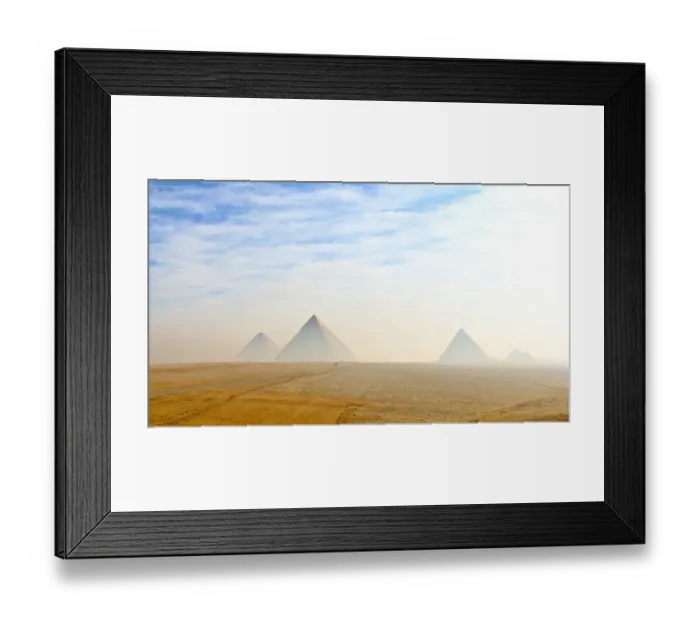 Framed Print : The Giza pyramids viewed from distance in morning haze and blue skies Framed Print : The Giza pyramids viewed from distance in morning haze and blue skies