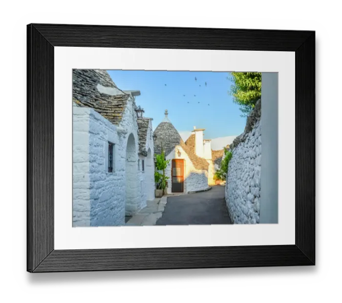 Framed Print : Narrow alley with trulli houses in Alberobello Framed Print : Narrow alley with trulli houses in Alberobello