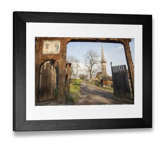 Framed Print : Wooden gate and orthodox church of Surdesti