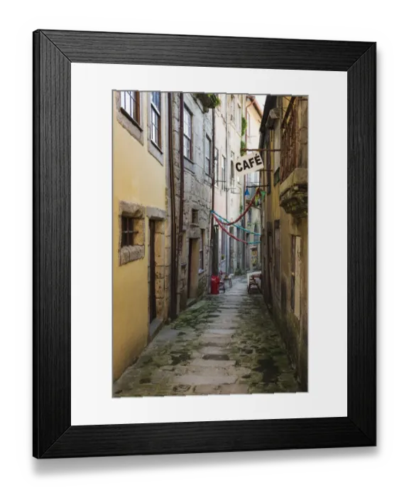 Framed Print : Green moss on the stone of a narrow alley between buildings and a cafe sign Framed Print : Green moss on the stone of a narrow alley between buildings and a cafe sign