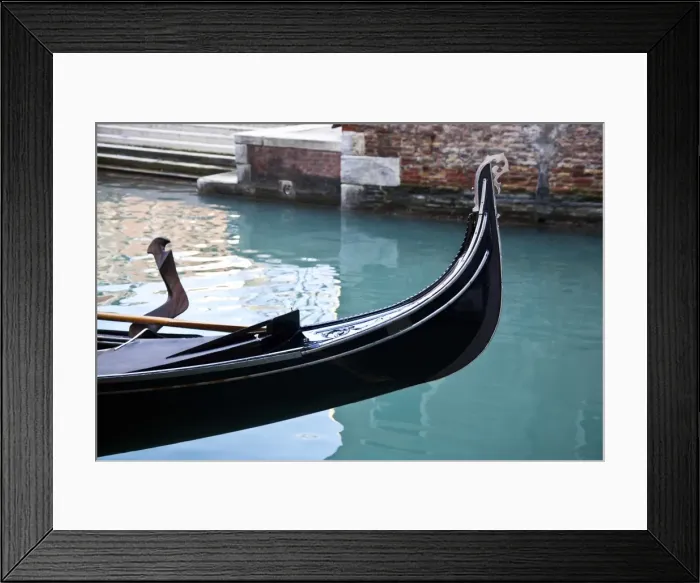Framed Print : Front of a gondola in a canal with turquoise water Framed Print : Front of a gondola in a canal with turquoise water
