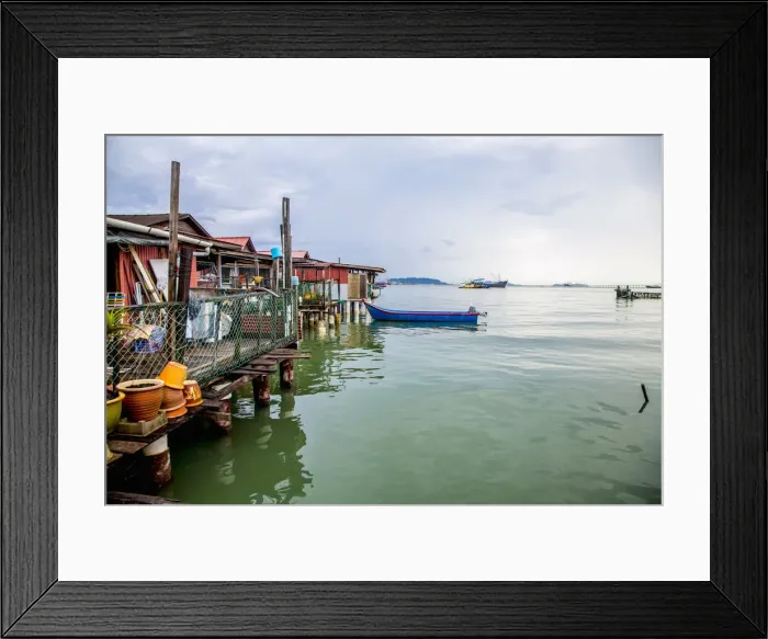 Framed Print : Boat docked along boathouses Framed Print : Boat docked along boathouses