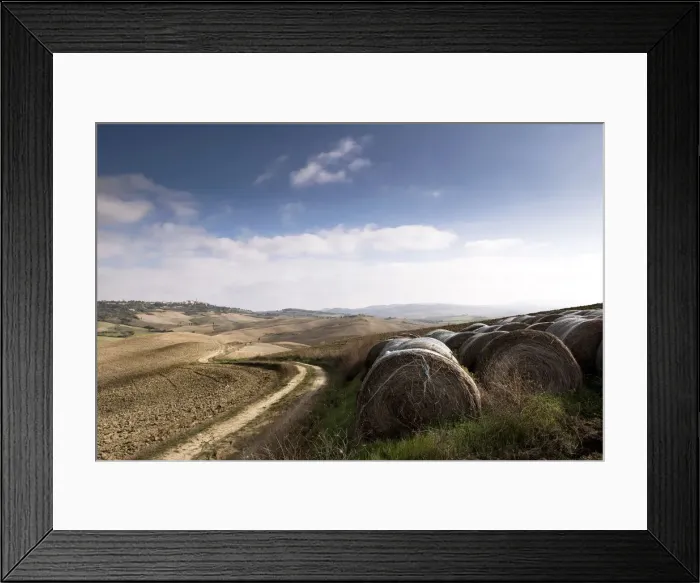 Framed Print : Rolls of bale and winding road in the landscape of Val d Orcia Framed Print : Rolls of bale and winding road in the landscape of Val d Orcia