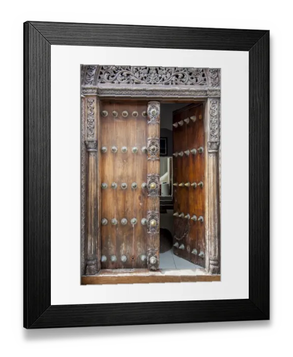 Framed Print : Intricately carved wooden Arab door in Stone Town Framed Print : Intricately carved wooden Arab door in Stone Town