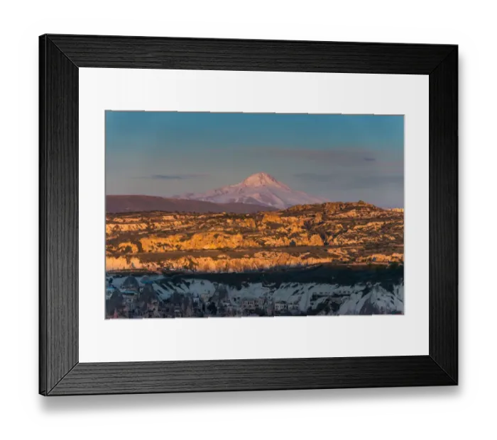 Framed Print : unique Rock formation of Goreme with Mount Erciyes background