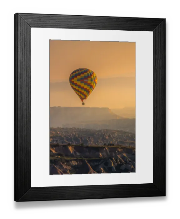 Framed Print : Hot air balloon over cappadocia rock landscape Framed Print : Hot air balloon over cappadocia rock landscape