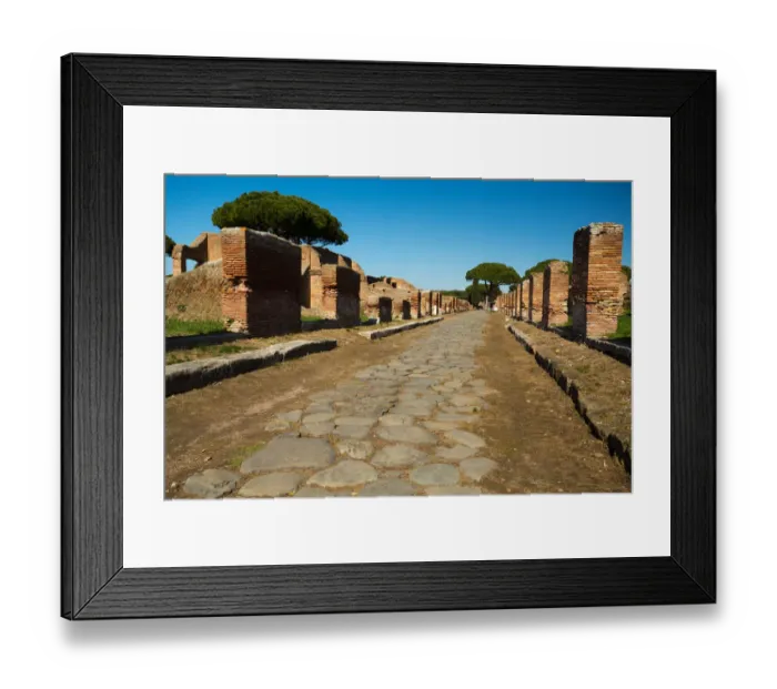 Framed Print : An ancient road in the ruins of the Ancient Roman harbour city of Ostia Antica in Rome, Italy Framed Print : An ancient road in the ruins of the Ancient Roman harbour city of Ostia Antica in Rome, Italy