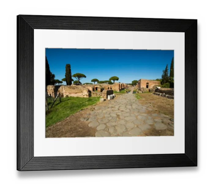 Framed Print : An ancient road in the ruins of the Ancient Roman harbour city of Ostia Antica in Rome, Italy Framed Print : An ancient road in the ruins of the Ancient Roman harbour city of Ostia Antica in Rome, Italy