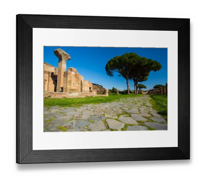 Framed Print : An ancient road in the ruins of the Ancient Roman harbour city of Ostia Antica in Rome, Italy Framed Print : An ancient road in the ruins of the Ancient Roman harbour city of Ostia Antica in Rome, Italy