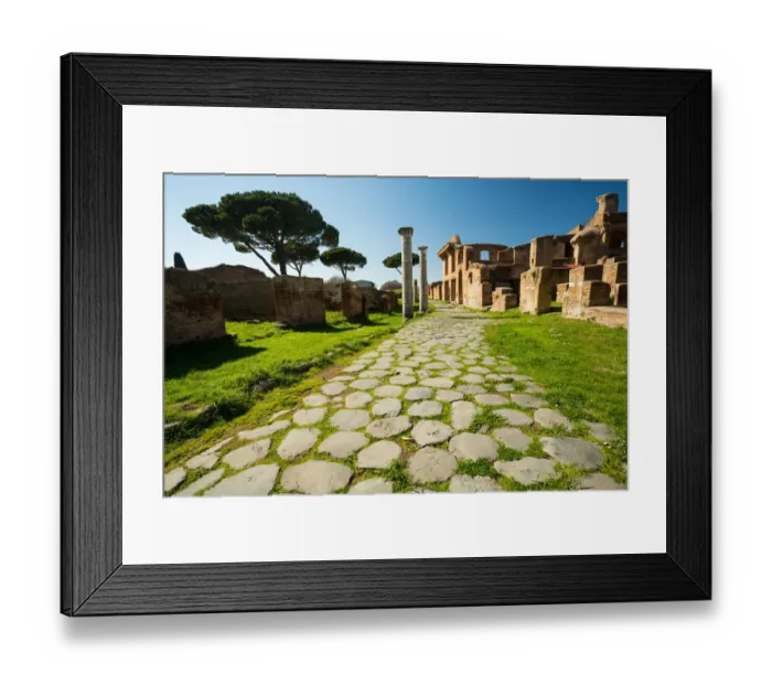 Framed Print : An ancient road in the ruins of the Ancient Roman harbour city of Ostia Antica in Rome, Italy Framed Print : An ancient road in the ruins of the Ancient Roman harbour city of Ostia Antica in Rome, Italy