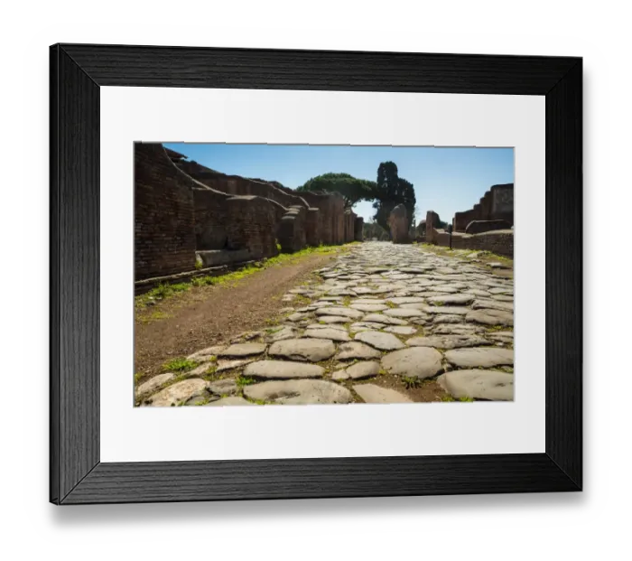 Framed Print : An ancient Roman road in the ruins of the Ancient Roman harbour city of Ostia Antica in Rome, Italy Framed Print : An ancient Roman road in the ruins of the Ancient Roman harbour city of Ostia Antica in Rome, Italy
