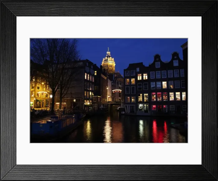 Framed Print : Typical Dutch canal houses and St. Nicholaschurch Framed Print : Typical Dutch canal houses and St. Nicholaschurch
