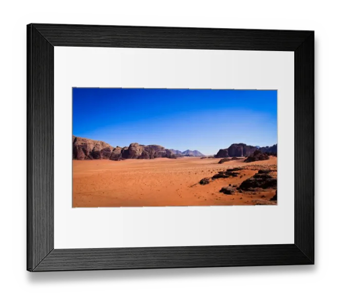 Framed Print : Panoramic view of Wadi Rum with clear blue sky background and some rock boulders Framed Print : Panoramic view of Wadi Rum with clear blue sky background and some rock boulders