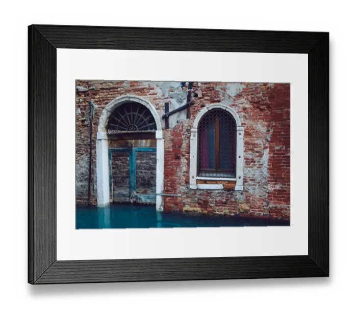 Framed Print : Half sunken door of townouse by the canal in Venice, Italy