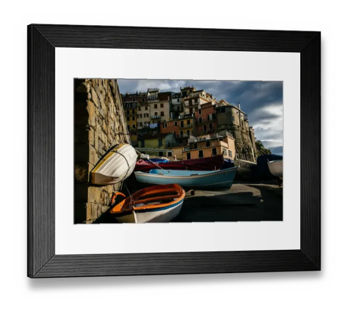 Framed Print : Kayaks with colorful houses of Manarola village in Cinque Terre National Park, Liguria, Italy Framed Print : Kayaks with colorful houses of Manarola village in Cinque Terre National Park, Liguria, Italy