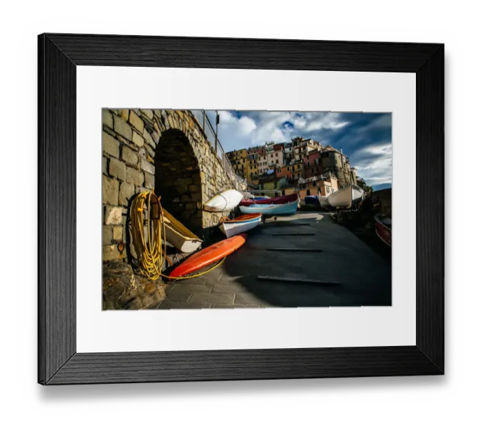 Framed Print : Kayaks with colorful houses of Manarola village in Cinque Terre National Park, Liguria, Italy Framed Print : Kayaks with colorful houses of Manarola village in Cinque Terre National Park, Liguria, Italy