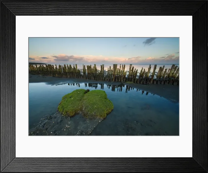 Framed Print : Reflecting the remants of human activity along the Waddensea in the Netherlands
