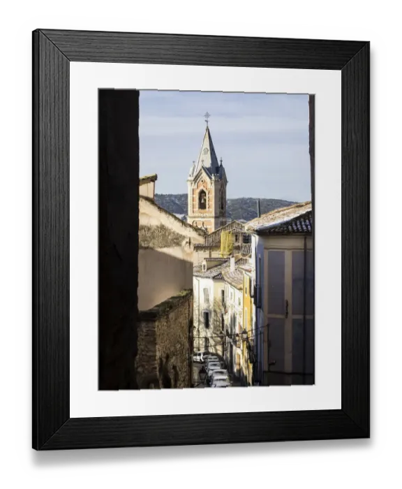 Framed Print : Sight of the Tower of the church of the Salvador in Cuenca, from inside an alley Framed Print : Sight of the Tower of the church of the Salvador in Cuenca, from inside an alley