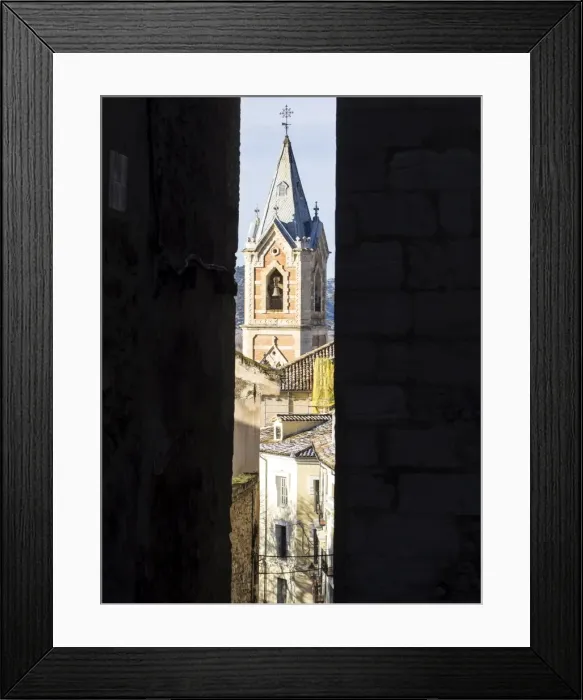 Framed Print : Sight of the Tower of the church of the Salvador in Cuenca, from inside an alley Framed Print : Sight of the Tower of the church of the Salvador in Cuenca, from inside an alley