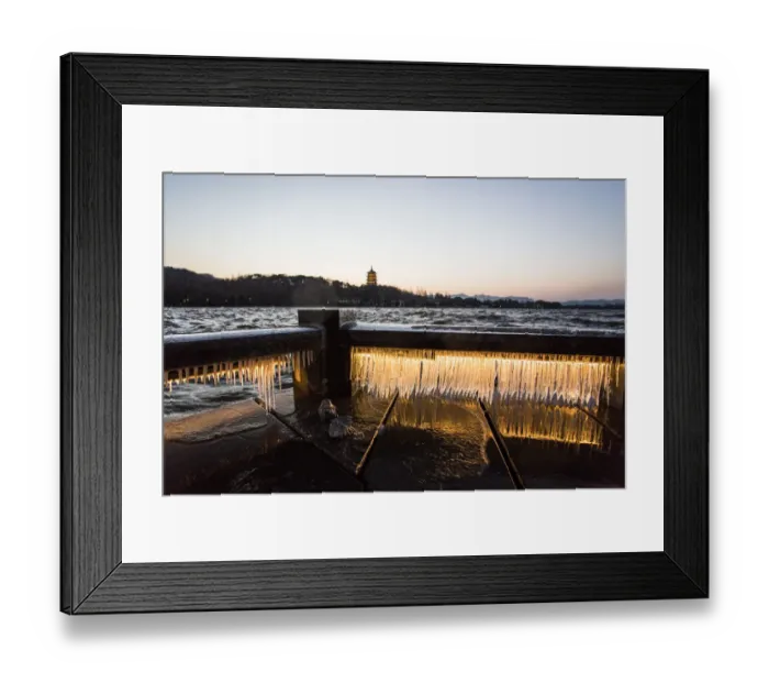 Framed Print : Illuminated icicles on bridge against the Leifeng Pagoda by the West Lake, Hangzhou, Zhejiang, China Framed Print : Illuminated icicles on bridge against the Leifeng Pagoda by the West Lake, Hangzhou, Zhejiang, China