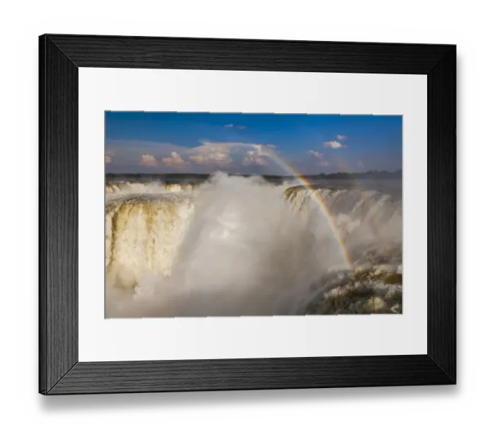 Framed Print : Rainbow over the Iguazu Falls at sunset