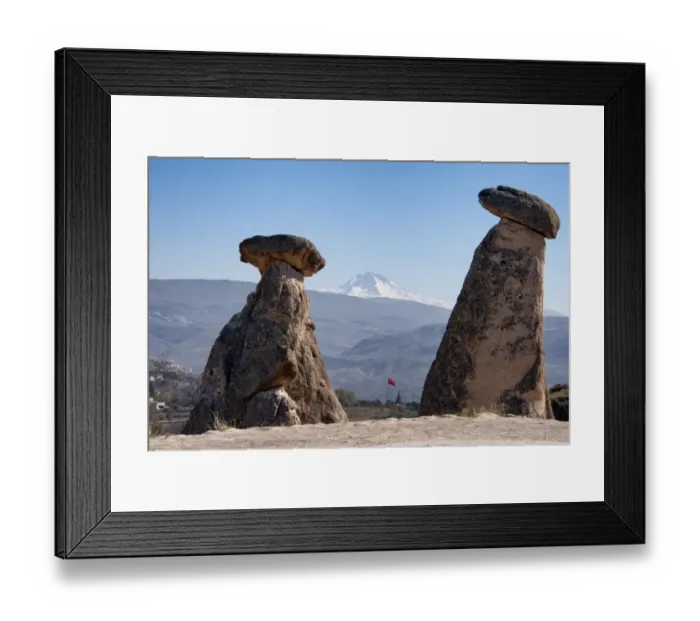 Framed Print : Fairy chimneys in Urgup with Mount Erciyes in the background, Cappadocia, Turkey Framed Print : Fairy chimneys in Urgup with Mount Erciyes in the background, Cappadocia, Turkey