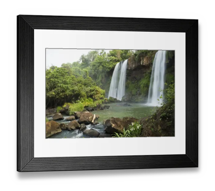 Framed Print : Three waterfalls in tropical landscape with flowers in foreground Framed Print : Three waterfalls in tropical landscape with flowers in foreground