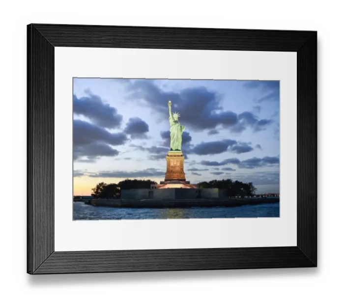 Framed Print : Statue of Liberty illuminated at dusk in New York Framed Print : Statue of Liberty illuminated at dusk in New York