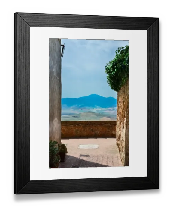 Framed Print : Narrow alley overlooking a rolling hill landscape Framed Print : Narrow alley overlooking a rolling hill landscape