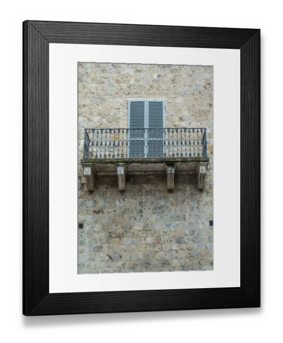 Framed Print : Balcony. Stone building and wrought iron balcony with pattern of arrows Framed Print : Balcony. Stone building and wrought iron balcony with pattern of arrows