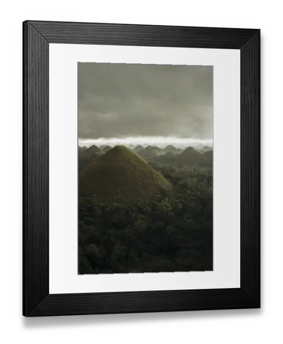 Framed Print : Chocolate hills landscape from Bohol Island, a big storm covers the sky making an interesting lighting effect Framed Print : Chocolate hills landscape from Bohol Island, a big storm covers the sky making an interesting lighting effect