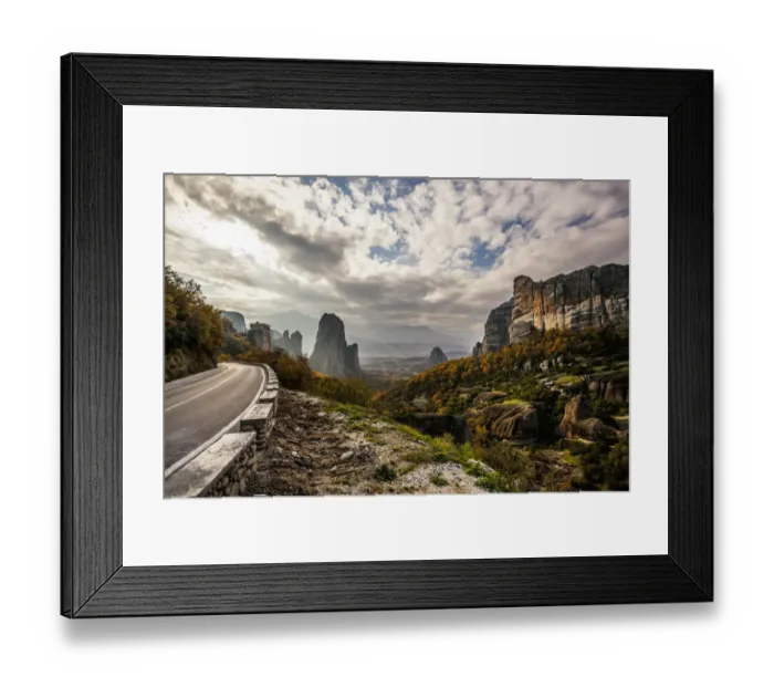 Framed Print : Landscape of rugged cliffs, road, autumn foliage and Monastery Rousanou in the distance Framed Print : Landscape of rugged cliffs, road, autumn foliage and Monastery Rousanou in the distance