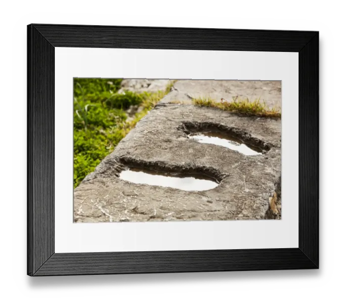 Framed Print : Footprints in a stone wall filled with water Framed Print : Footprints in a stone wall filled with water
