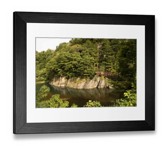 Framed Print : Sho river and a suspension bridge