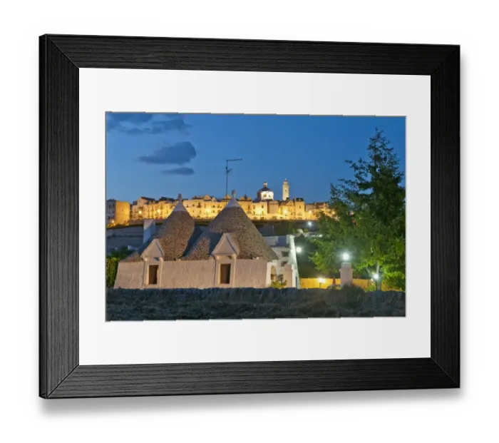 Framed Print : Trulli and the town on the background Framed Print : Trulli and the town on the background