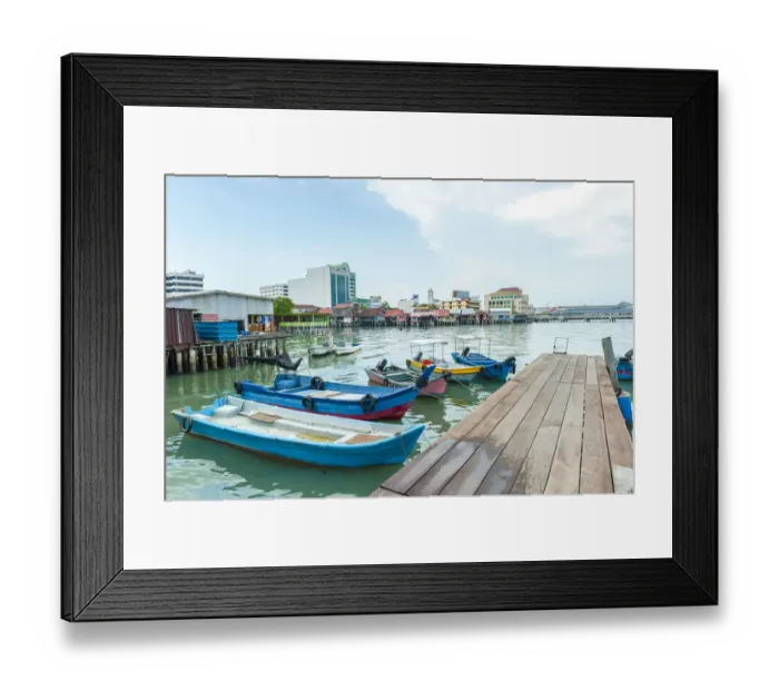 Framed Print : An exotic timber jetty with wooden sampan boats
