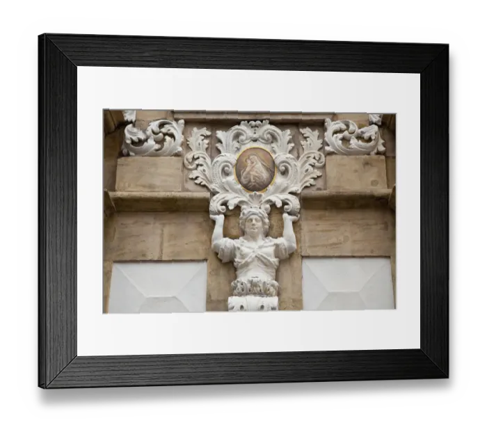 Framed Print : Sculpture On The Facade Of An Old Building Framed Print : Sculpture On The Facade Of An Old Building