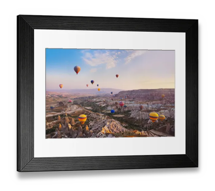Framed Print : Hot air balloon flying over Cappadocia Turkey Framed Print : Hot air balloon flying over Cappadocia Turkey