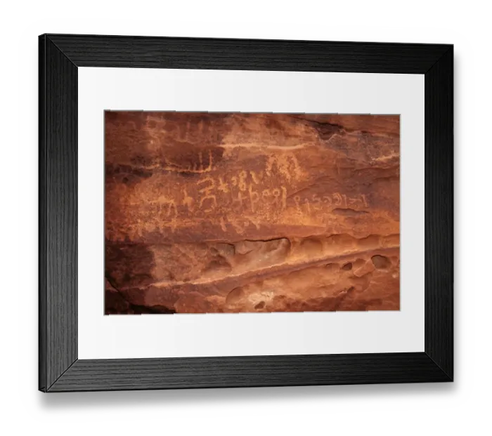 Framed Print : Ancient Nabatean Petroglyphs rock engravings in Wadi Rum desert Jordan Framed Print : Ancient Nabatean Petroglyphs rock engravings in Wadi Rum desert Jordan