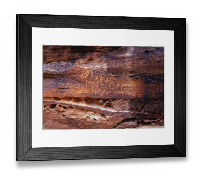 Framed Print : Ancient Nabatean Petroglyphs rock engravings in Wadi Rum desert Jordan