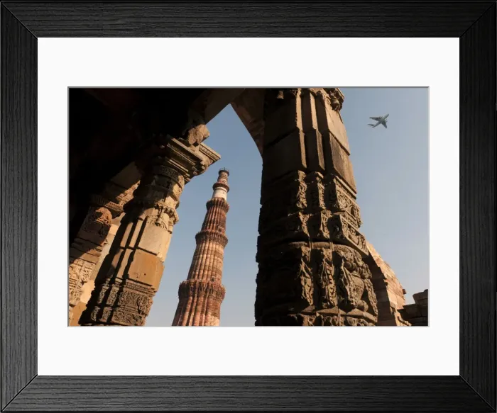 Framed Print : Qutb Minar minaret with aircraft flying above, UNESCO World Cultural Heritage, New Delhi, India Framed Print : Qutb Minar minaret with aircraft flying above, UNESCO World Cultural Heritage, New Delhi, India