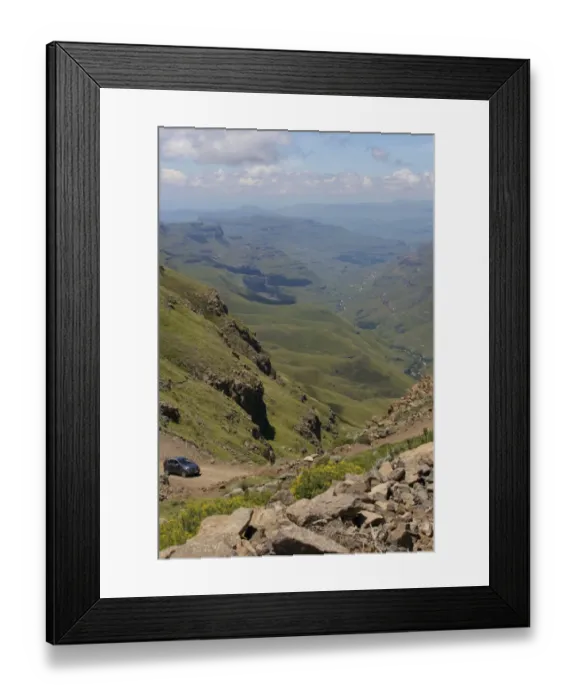 Framed Print : A vehicle driving along a trail through the hills of the Sani Pass, Drakensberg Park, KwaZulu-Natal, South Africa Framed Print : A vehicle driving along a trail through the hills of the Sani Pass, Drakensberg Park, KwaZulu-Natal, South Africa
