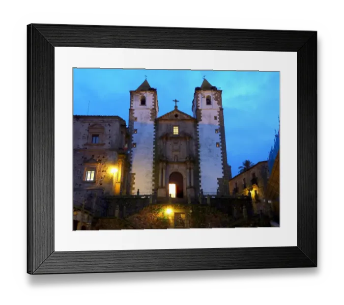 Framed Print : Monumental church in Caceres illuminated at dusk