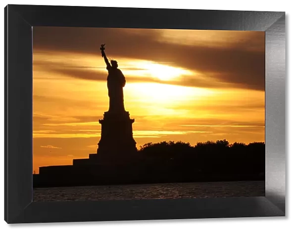 Silhouette of Statue Of Liberty during Sunset