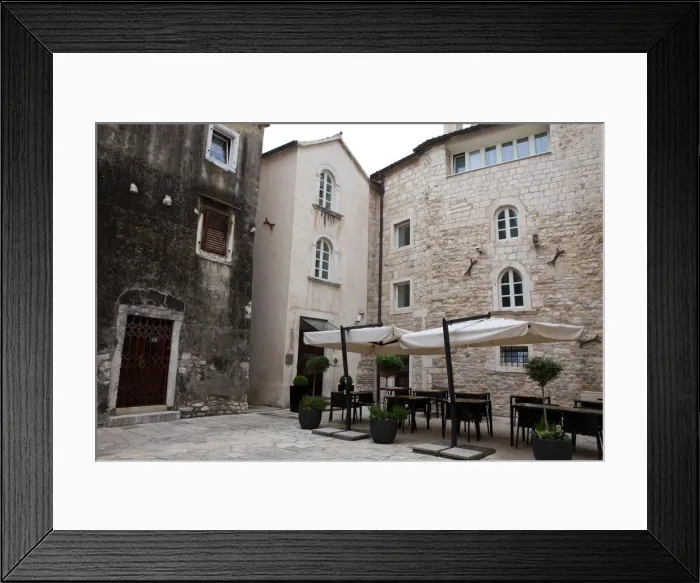 Framed Print : Tables and Chairs in Small Town Square Framed Print : Tables and Chairs in Small Town Square