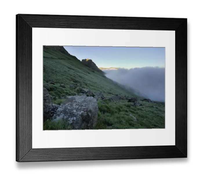 Framed Print : Clouds rising along a grassy slope in the Royal Natal section of the Drakensberg Mountains, Drakensberg Ukhahlamba National Park, South Africa Framed Print : Clouds rising along a grassy slope in the Royal Natal section of the Drakensberg Mountains, Drakensberg Ukhahlamba National Park, South Africa