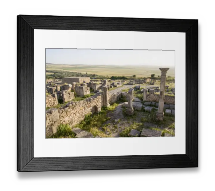 Framed Print : Old Roman ruins in Volubilis at sunset